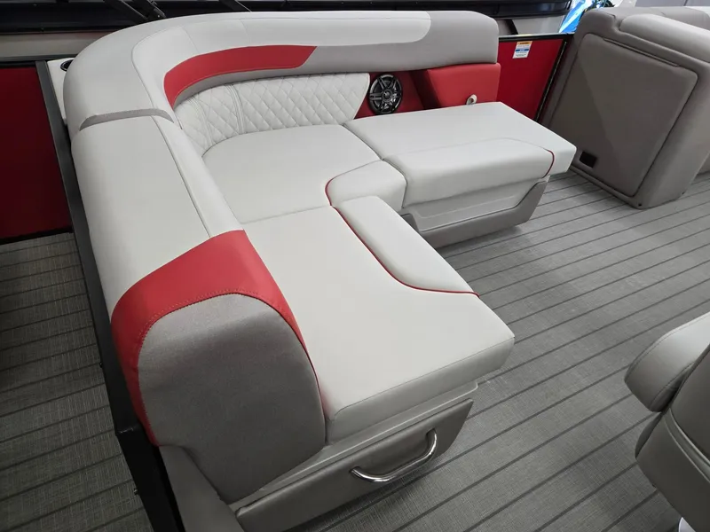 Slide: The Image of 2025 Godfrey Sweetwater 2286 FS boat interior with red and gray seating. - 23