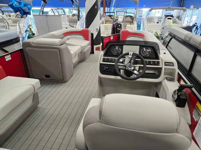 Slide: The Image of 2025 Godfrey Sweetwater 2286 FS pontoon boat interior with modern seating and steering console. - 24
