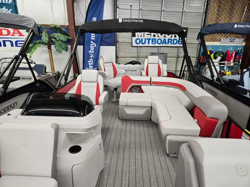 Slide: The Image of 2025 Godfrey Sweetwater 2286 FS pontoon boat with spacious seating and modern design. - 4