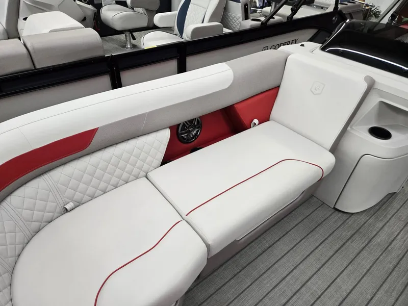 Slide: The Image of 2025 Godfrey Sweetwater 2286 FS boat interior with white and red seating. - 5