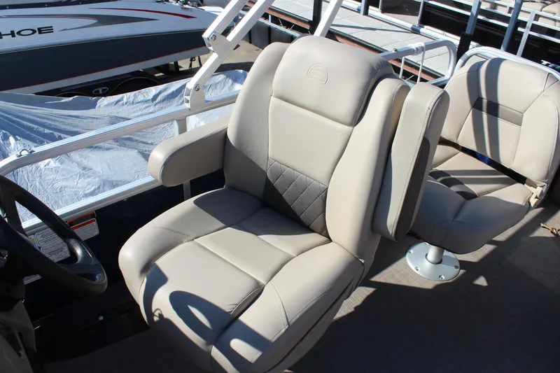 Slide: The Image of 2024 Sun Tracker BB18 boat seats, beige upholstery, modern design. - 13