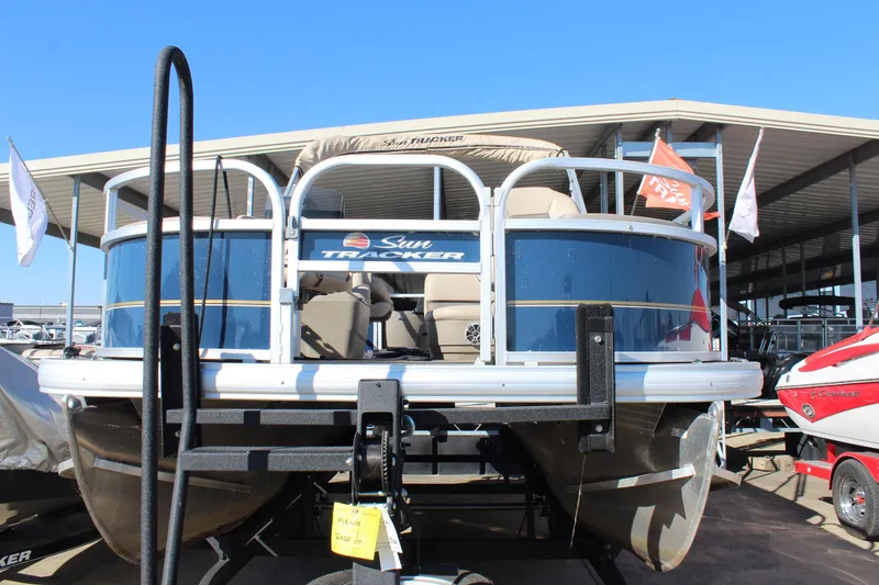 Slide: The Image of 2024 Sun Tracker BB18 pontoon boat at marina, front view. - 3