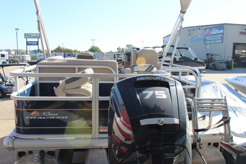 Slide: The Image of 2024 Sun Tracker BB18 pontoon boat with Mercury 75 engine at dealership. - 4