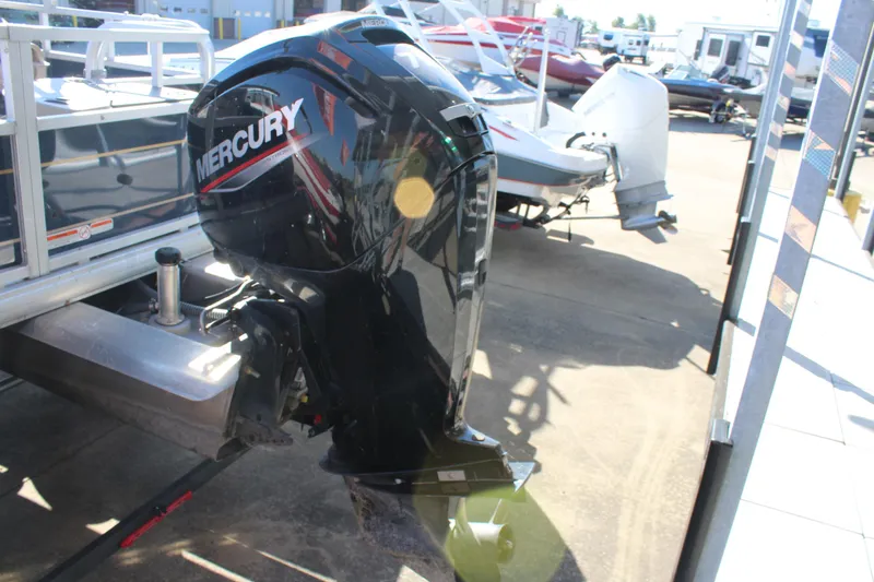 Slide: The Image of 2024 Sun Tracker BB18 with Mercury outboard motor in a boatyard. - 5