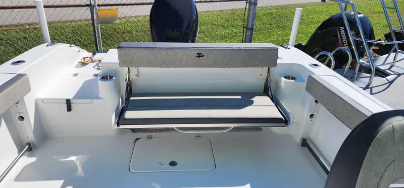 Slide: The Image of 2025 Sea Pro 240 Sport boat interior with seating and storage. - 10