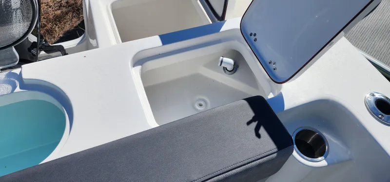 Slide: The Image of 2025 Sea Pro 240 Sport boat interior with storage compartments and seating. - 11