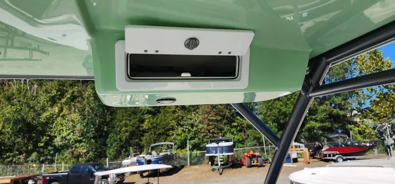 Slide: The Image of 2025 Sea Pro 240 Sport boat interior, featuring a sleek overhead compartment. - 12