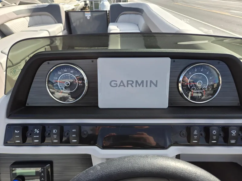 Slide: The Image of Dashboard of 2025 Godfrey Sweetwater 2286 C with Garmin display and gauges. - 14