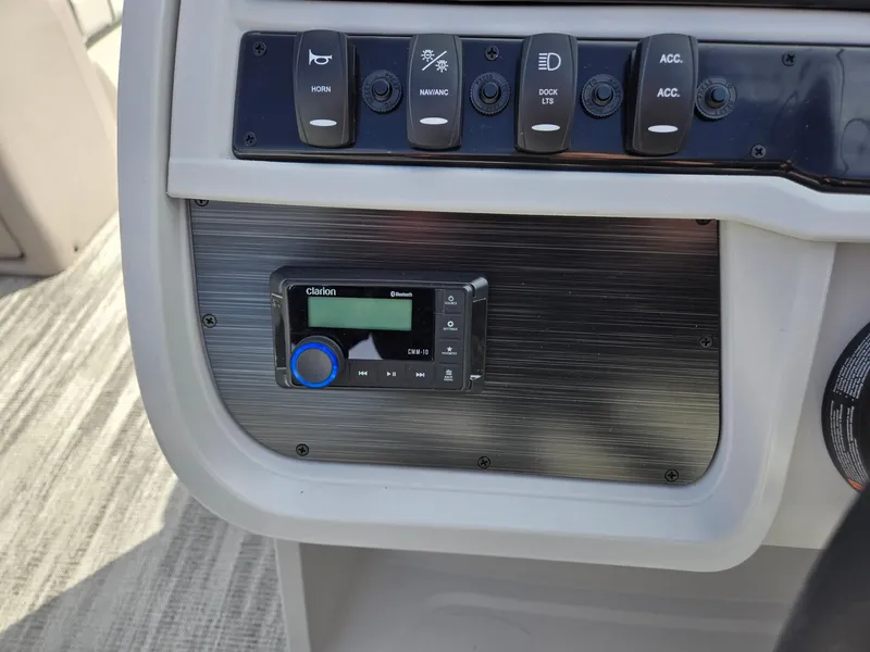 Slide: The Image of Control panel of 2025 Godfrey Sweetwater 2286 C boat with switches and display. - 15