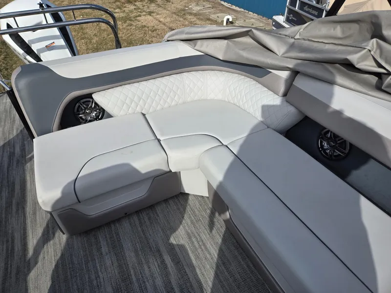 Slide: The Image of 2025 Godfrey Sweetwater 2286 C boat interior with plush seating and modern design. - 18