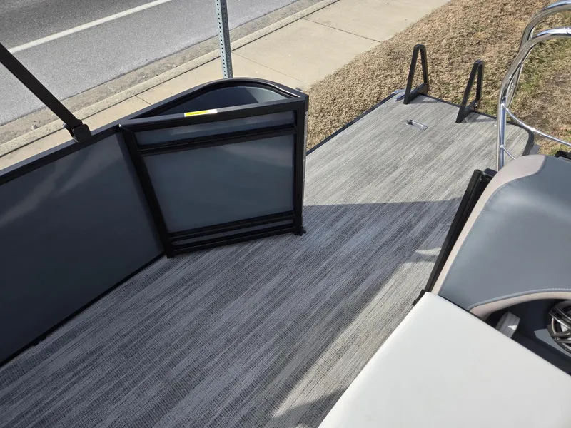 Slide: The Image of 2025 Godfrey Sweetwater 2286 C boat interior with gray flooring and seating. - 20