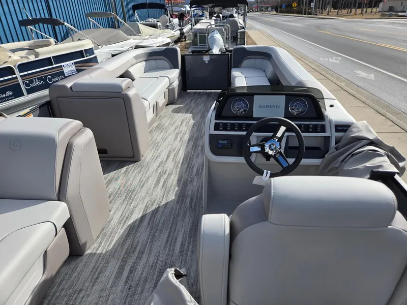 Slide: The Image of 2025 Godfrey Sweetwater 2286 C pontoon boat interior with modern dashboard and seating. - 27