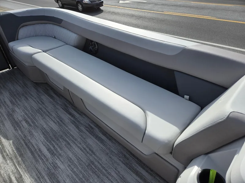 Slide: The Image of 2025 Godfrey Sweetwater 2286 C boat interior with sleek gray seating and modern design. - 32