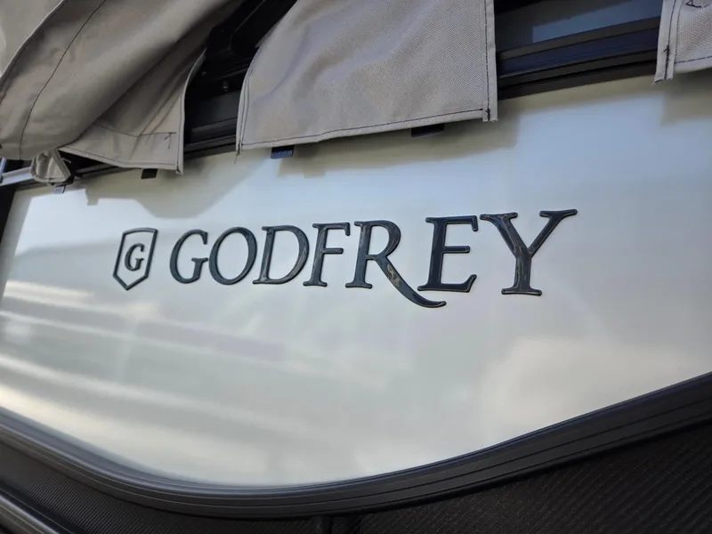 Slide: The Image of 2025 Godfrey Sweetwater 2286 C boat logo with protective cover. - 34