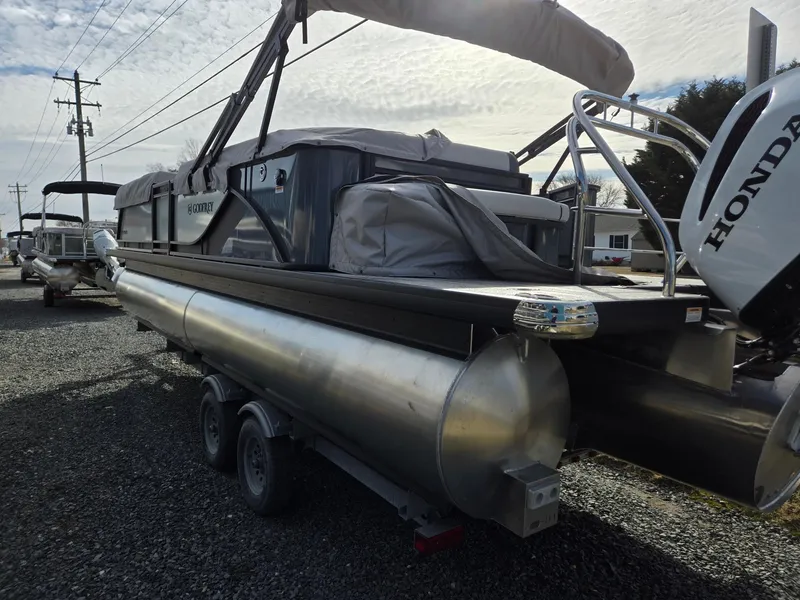 Slide: The Image of 2025 Godfrey Sweetwater 2286 C pontoon boat on trailer, featuring Honda outboard motor. - 4