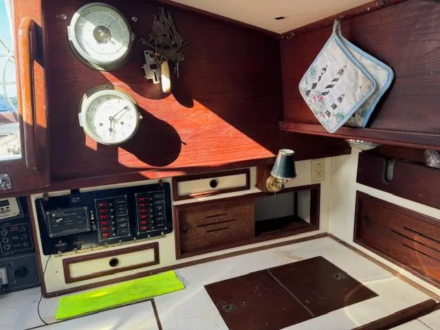 Slide: The Image of Interior of 1980 Cape Dory 36 sailboat with navigation instruments and wooden cabinetry. - 14