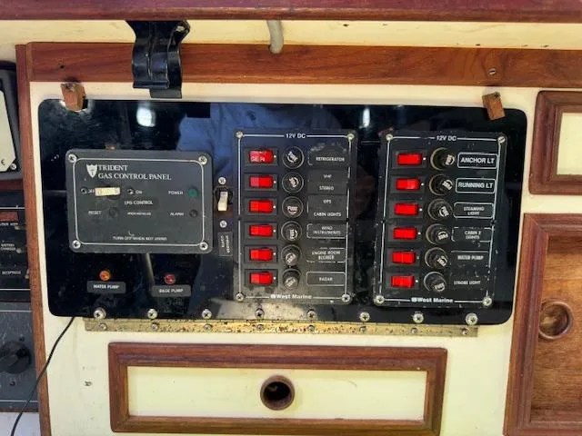 Slide: The Image of Control panel of a 1980 Cape Dory 36 boat with switches and indicators. - 15
