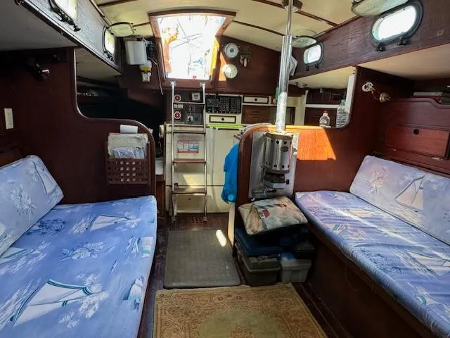 Slide: The Image of Interior of 1980 Cape Dory 36 sailboat with cozy seating and nautical decor. - 20