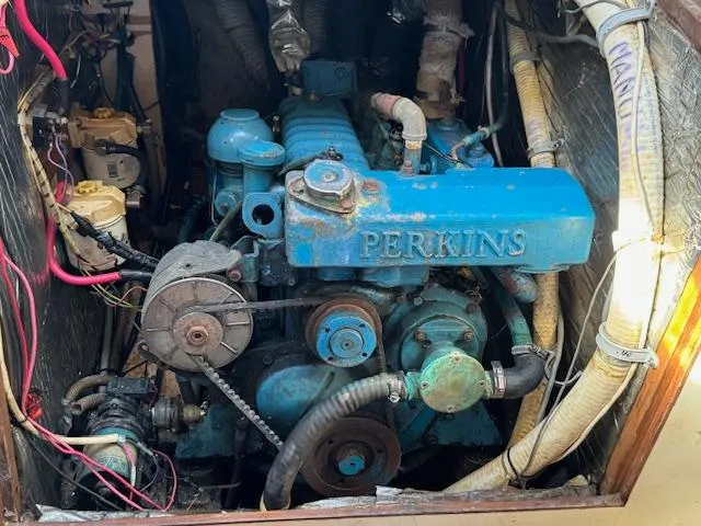 Slide: The Image of Perkins engine in a 1980 Cape Dory 36 sailboat, showing wiring and components. - 27