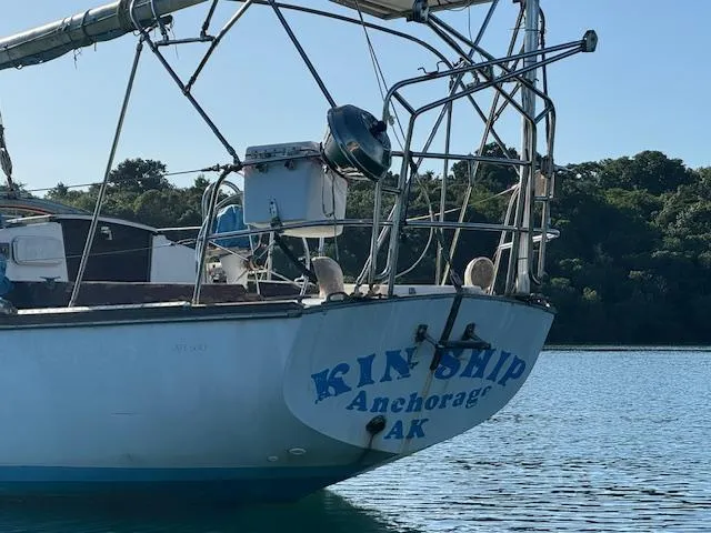 Slide: The Image of 1980 Cape Dory 36 sailboat named "Kinship" anchored in calm waters, Anchorage, AK. - 6