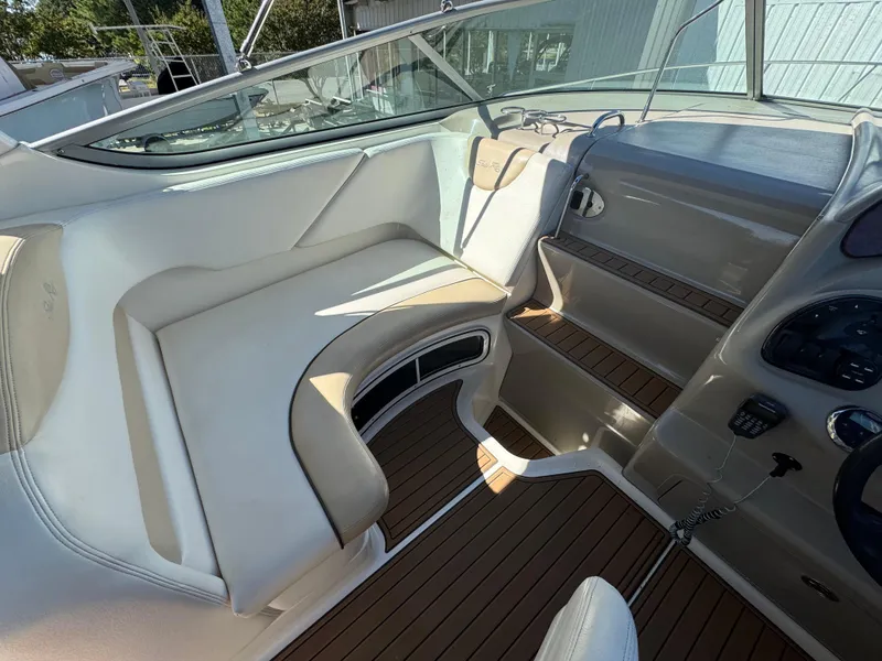 Slide: The Image of Interior view of 2008 Sea Ray 280 Sundancer boat with seating and dashboard. - 11