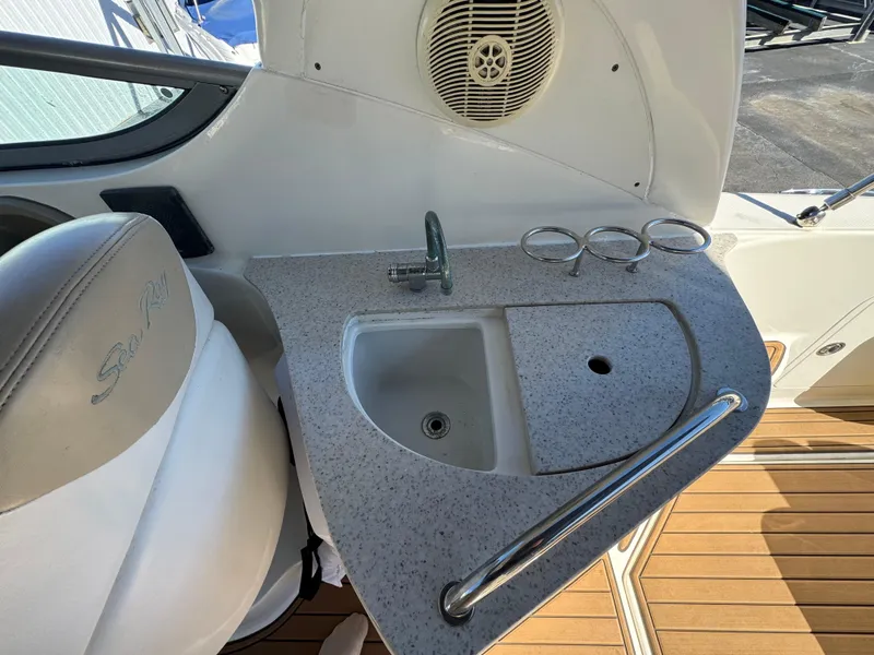 Slide: The Image of 2008 Sea Ray 280 Sundancer boat sink and countertop with cup holders. - 15
