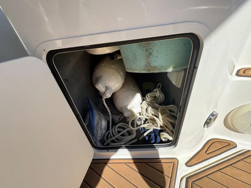 Slide: The Image of Storage compartment on 2008 Sea Ray 280 Sundancer with ropes and fenders. - 16