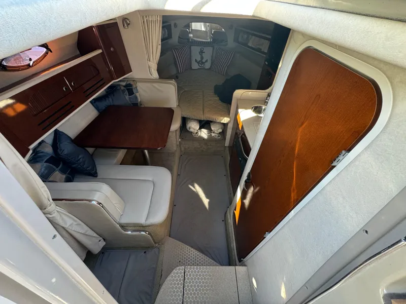 Slide: The Image of Interior of 2008 Sea Ray 280 Sundancer boat with seating and table. - 18