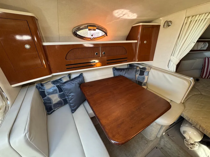 Slide: The Image of Luxurious 2008 Sea Ray 280 Sundancer cabin with elegant wood table and plush seating. - 19