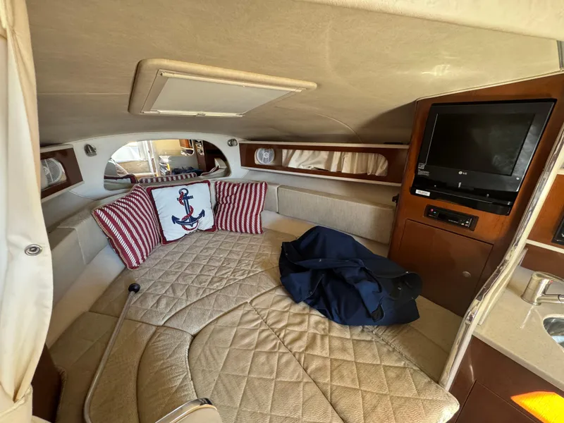 Slide: The Image of Interior of 2008 Sea Ray 280 Sundancer with cozy bed and TV. - 20