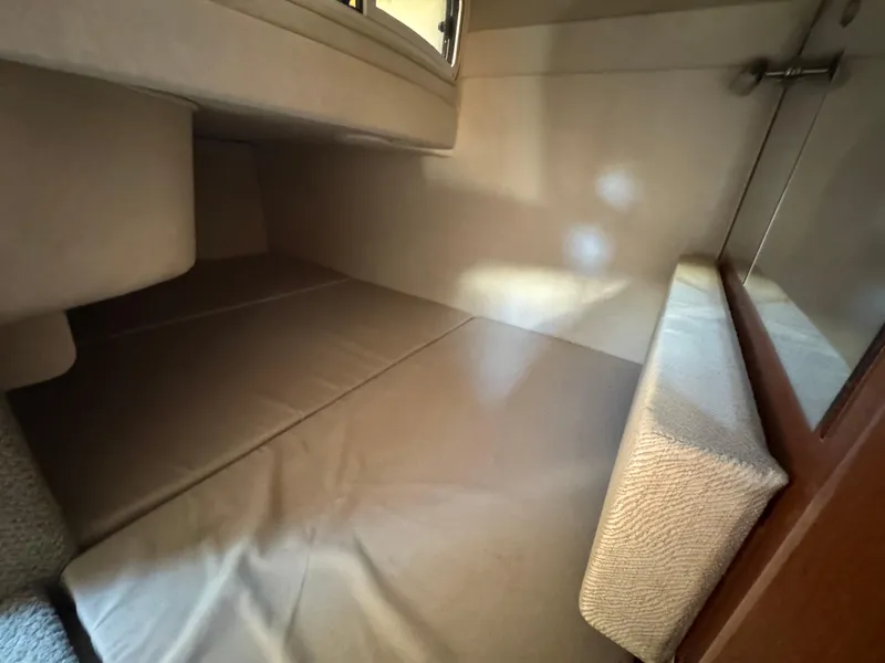 Slide: The Image of Interior cabin of 2008 Sea Ray 280 Sundancer, featuring cozy sleeping area. - 29