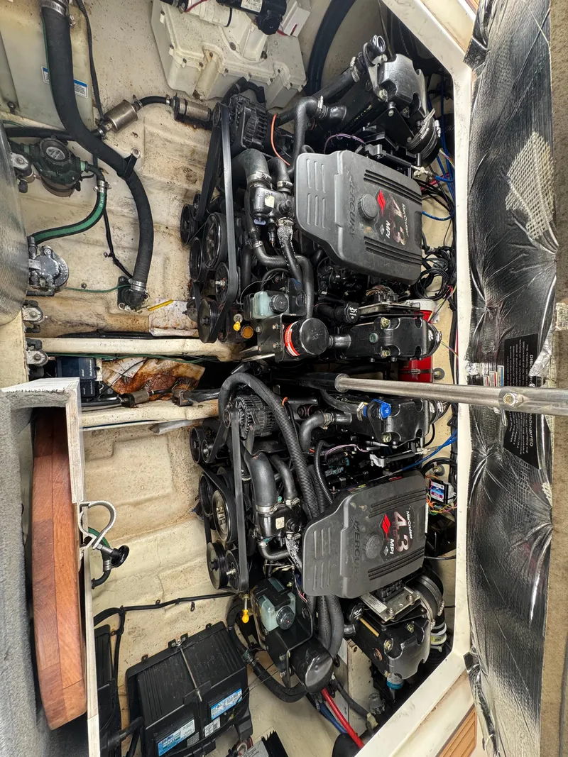 Slide: The Image of Engine compartment of 2008 Sea Ray 280 Sundancer with dual engines and mechanical components. - 30