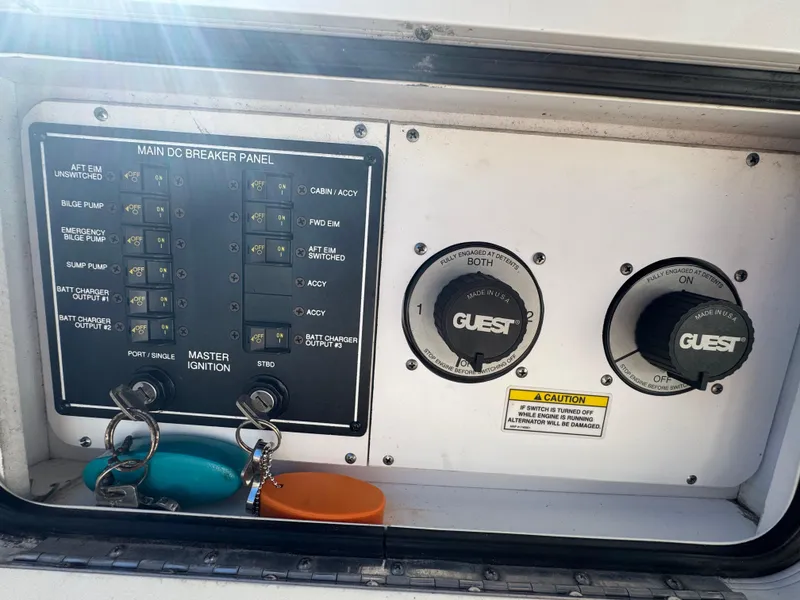 Slide: The Image of Main DC breaker panel on 2008 Sea Ray 280 Sundancer boat with ignition keys. - 31