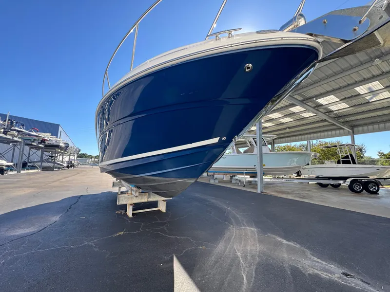 Slide: The Image of 2008 Sea Ray 280 Sundancer boat in a marina, blue hull, sunny day. - 4