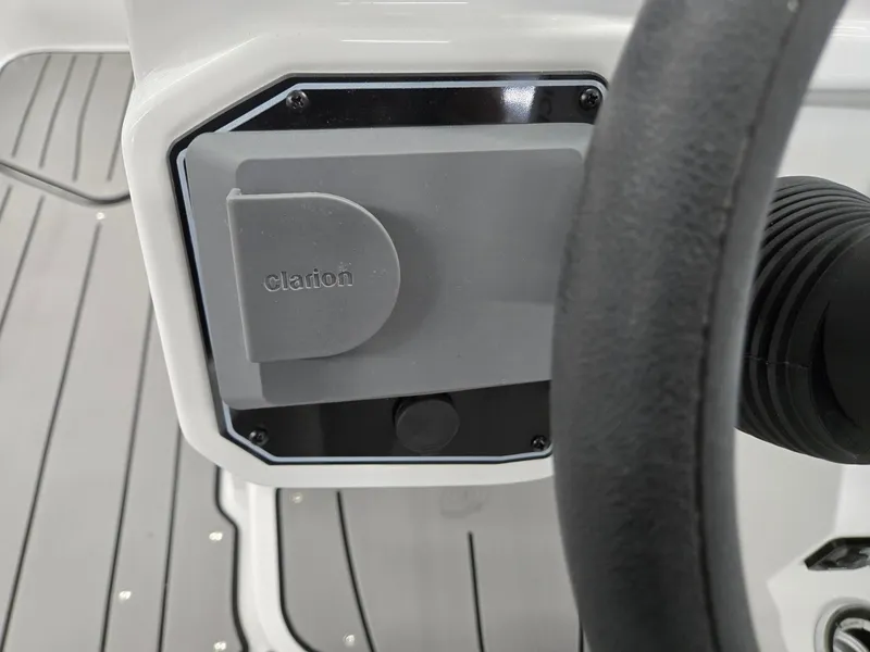 Slide: The Image of 2025 Hurricane SunDeck 2050 OB boat dashboard with Clarion audio system. - 12