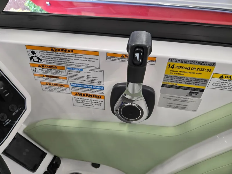 Slide: The Image of Control panel and warning labels on 2025 Hurricane SunDeck 2050 OB boat. - 13