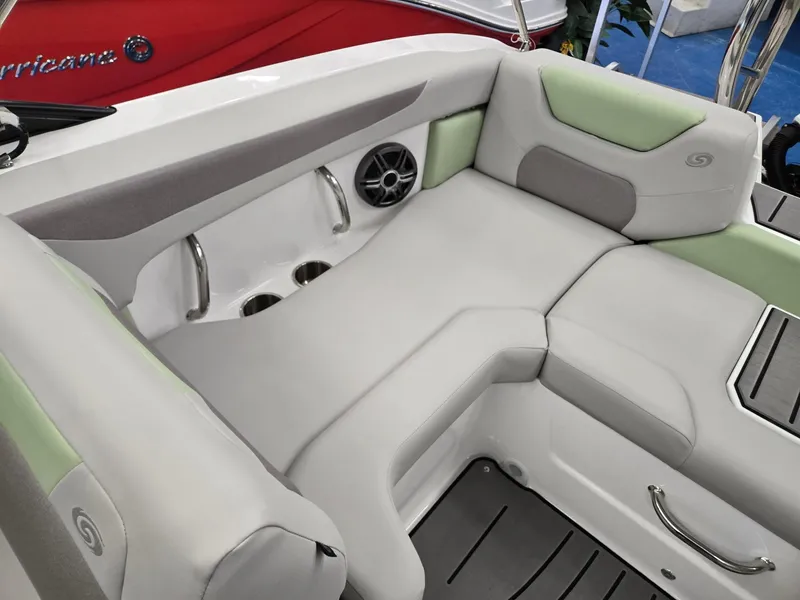Slide: The Image of 2025 Hurricane SunDeck 2050 OB boat interior with cushioned seating and cup holders. - 14