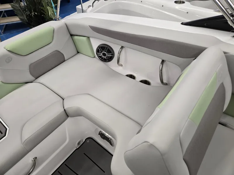 Slide: The Image of 2025 Hurricane SunDeck 2050 OB boat interior with cushioned seating and cup holders. - 16