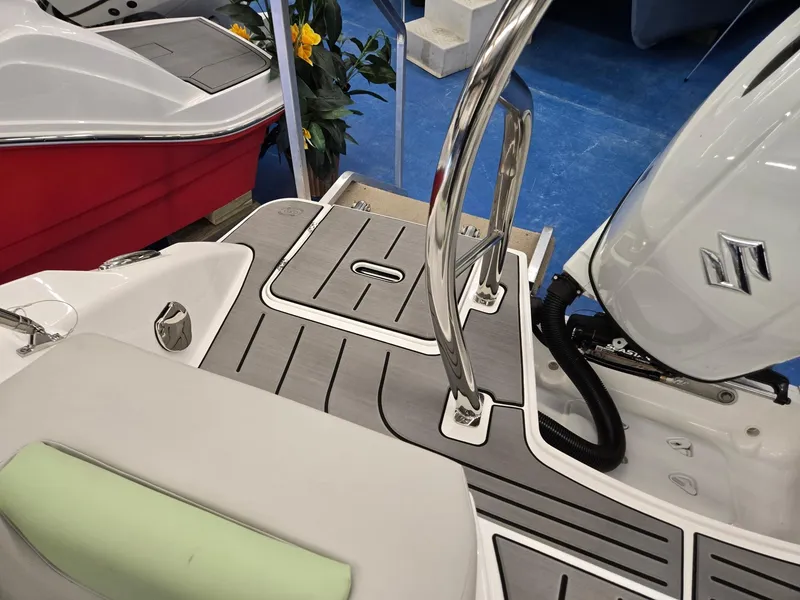 Slide: The Image of 2025 Hurricane SunDeck 2050 OB boat deck with Suzuki outboard motor and sleek design. - 18