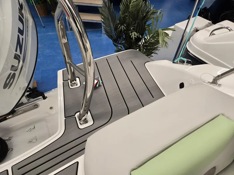 Slide: The Image of 2025 Hurricane SunDeck 2050 OB boat deck with Suzuki engine, featuring sleek design and modern fittings. - 19