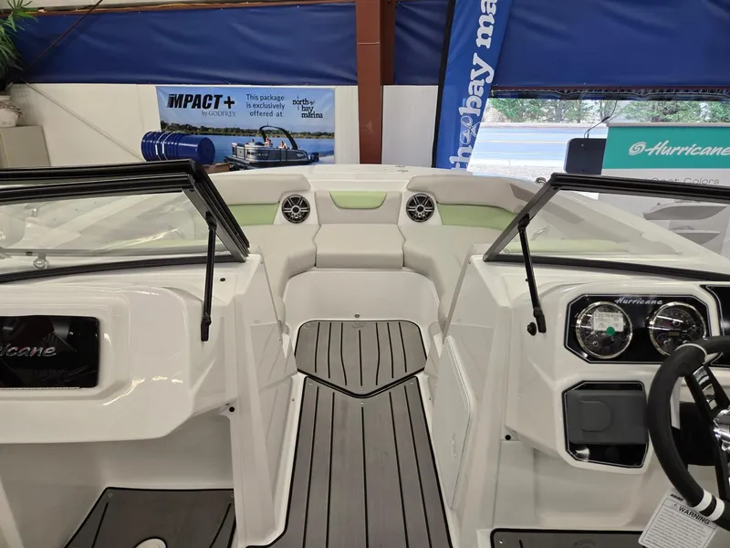 Slide: The Image of 2025 Hurricane SunDeck 2050 OB boat interior with modern dashboard and seating. - 20