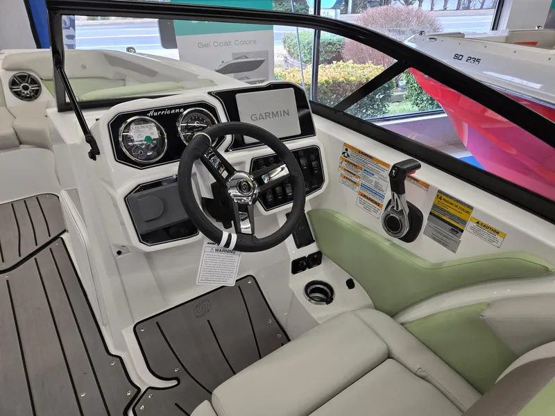 Slide: The Image of 2025 Hurricane SunDeck 2050 OB boat interior with Garmin navigation system. - 22