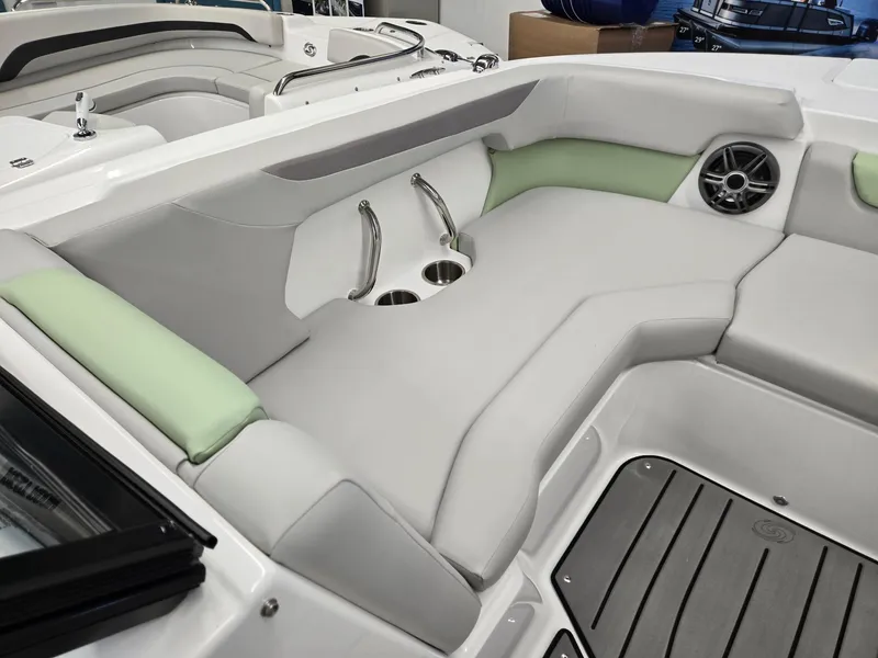 Slide: The Image of 2025 Hurricane SunDeck 2050 OB boat interior with cushioned seating and cup holders. - 24