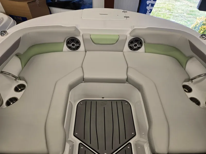 Slide: The Image of 2025 Hurricane SunDeck 2050 OB boat interior with seating and cup holders. - 25