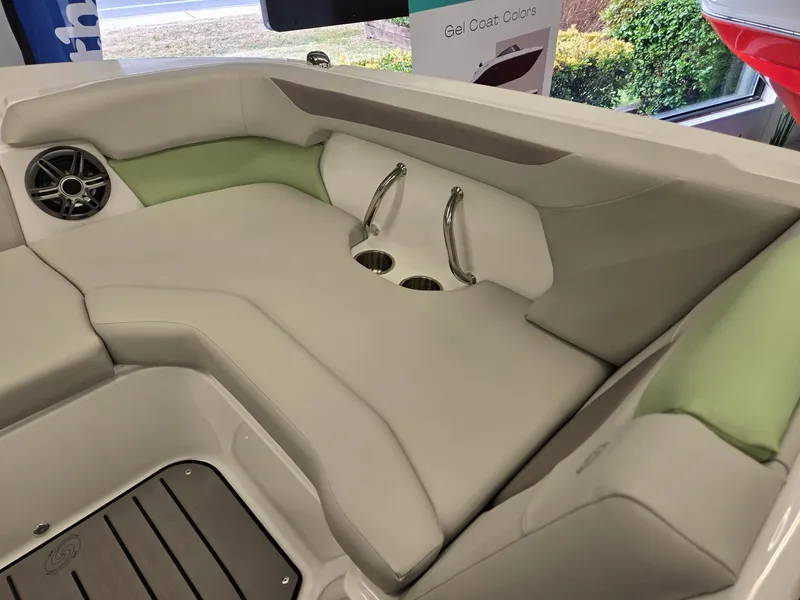 Slide: The Image of 2025 Hurricane SunDeck 2050 OB boat interior with cushioned seating and cup holders. - 26