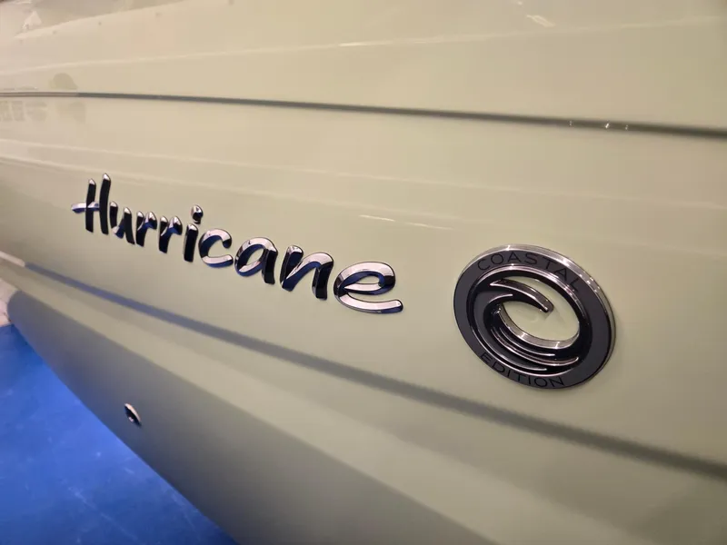 Slide: The Image of 2025 Hurricane SunDeck 2050 OB boat logo on side panel. - 28