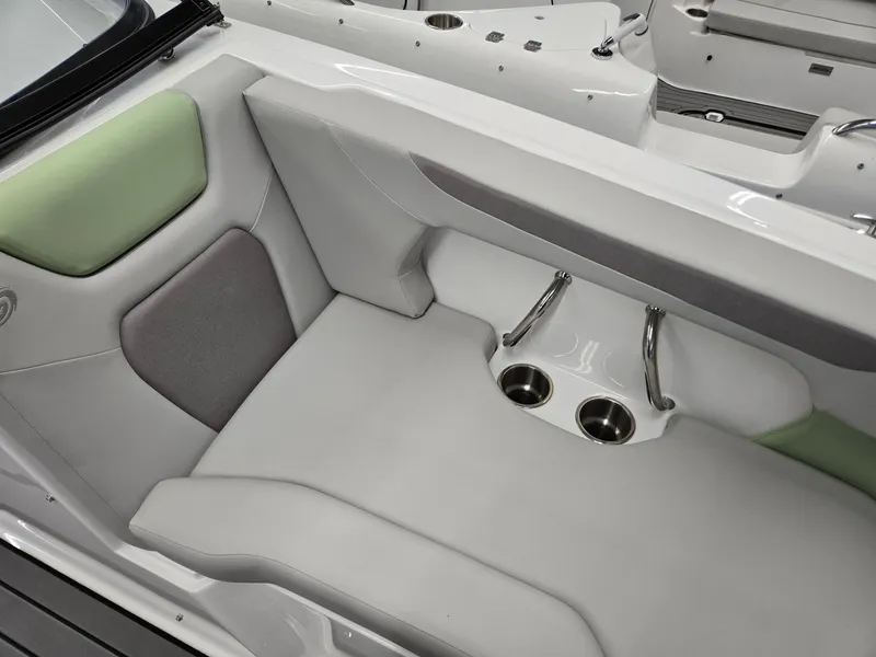 Slide: The Image of 2025 Hurricane SunDeck 2050 OB boat interior with cushioned seating and cup holders. - 6