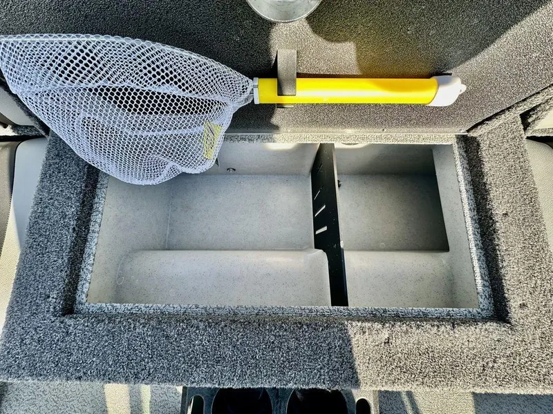 Slide: The Image of Open storage compartment in 2024 Lund 1975 Tyee Sport boat with fishing net. - 11