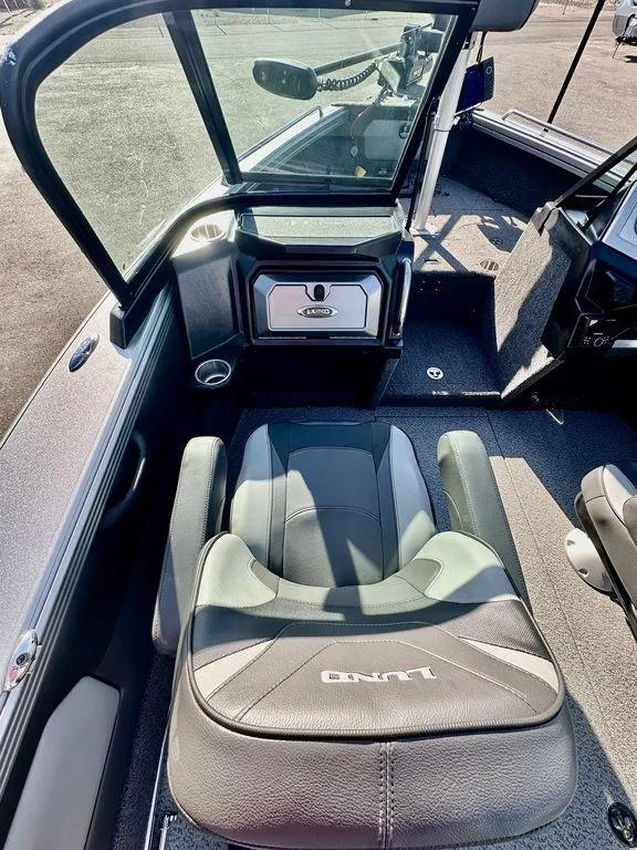 Slide: The Image of Interior of 2024 Lund 1975 Tyee Sport boat with comfortable seating and modern design. - 13