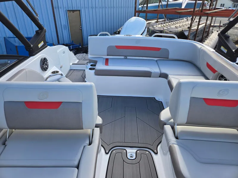 Slide: The Image of 2025 Hurricane SunDeck 235 OB boat interior with modern seating and sleek design. - 11